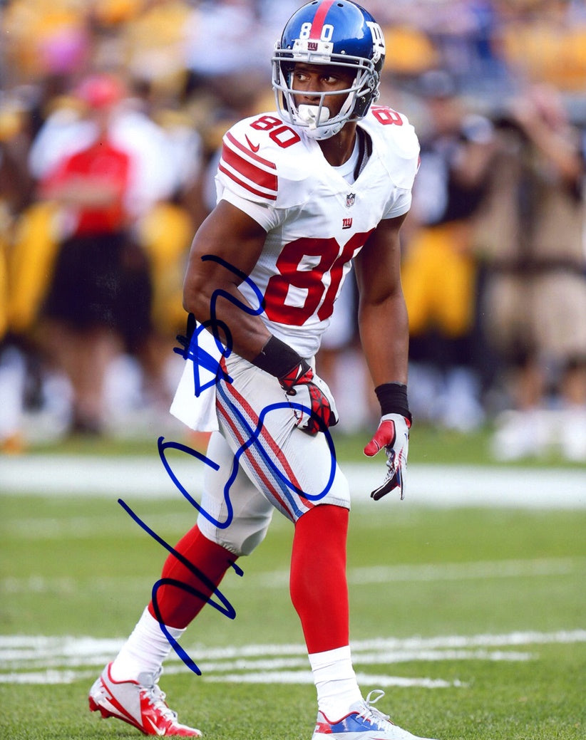 New York Giants wide receiver VICTOR CRUZ celebrates his 34 yard catch